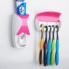 TOOTHPASTE DISPENSER AND TOOTHBRUSH HOLDER